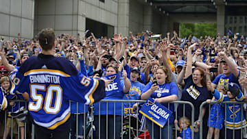 Jun 15, 2019; St. Louis, MO, USA; St. Louis Blues goaltender Jordan Binnington (50) celebrates with fans during the Stanley Cup championship parade and rally at the Gateway Arch. Mandatory Credit: Jeff Curry-Imagn Images