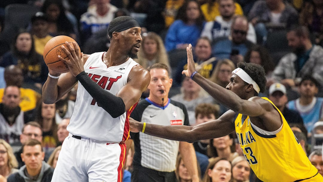 Nov 15, 2024; Indianapolis, Indiana, USA; Miami Heat center Bam Adebayo (13) holds the ball while Indiana Pacers forward Pascal Siakam (43) defends in the first half at Gainbridge Fieldhouse. 