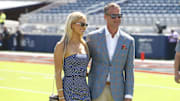 Mississippi Rebels head coach Lane Kiffin poses for a photo with his daughter Landry Kiffin prior to the game against the LSU Tigers at Vaught-Hemingway Stadium.