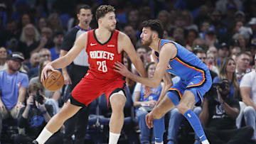 Oct 21, 2025; Oklahoma City, Oklahoma, USA; Houston Rockets center Alperen Sengun (28) drives to the basket against Oklahoma City Thunder center Chet Holmgren (7) during the first half at Paycom Center. Mandatory Credit: Alonzo Adams-Imagn Images