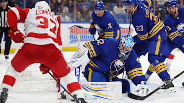 Oct 22, 2025; Buffalo, New York, USA;  Buffalo Sabres goaltender Colten Ellis (92) makes a pad save on Detroit Red Wings left wing J.T. Compher (37) during the third period at KeyBank Center. Mandatory Credit: Timothy T. Ludwig-Imagn Images