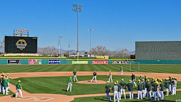 Feb 16, 2024; Mesa, AZ, USA; Oakland Athletics players run drills during a Spring Training workout at Hohokum stadium. 