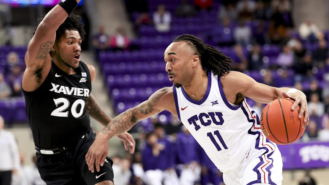 Dec 5, 2024; Fort Worth, Texas, USA;  TCU Horned Frogs guard Frankie Collins (11) drives to the basket as Xavier Musketeers guard Dayvion McKnight (20) during the first half at Ed and Rae Schollmaier Arena. Mandatory Credit: Kevin Jairaj-Imagn Images