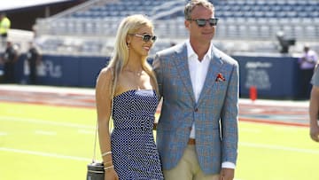 Then Mississippi Rebels head coach Lane Kiffin poses for a photo with his daughter Landry Kiffin prior to the game against the LSU Tigers at Vaught-Hemingway Stadium. 