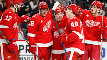 Nov 13, 2025; Detroit, Michigan, USA;  Detroit Red Wings defenseman Axel Sandin-Pellikka (44) receives congratulations from teammates after scoring in the second period against the Anaheim Ducks at Little Caesars Arena. Mandatory Credit: Rick Osentoski-Imagn Images