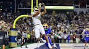Nov 22, 2025; Atlanta, Georgia, USA; Georgia Tech Yellow Jackets wide receiver Isiah Canion (4) catches a touchdown pass against the Pittsburgh Panthers in the fourth quarter at Bobby Dodd Stadium at Hyundai Field. Mandatory Credit: Brett Davis-Imagn Images