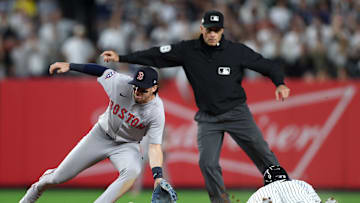 Wild Card Series - Boston Red Sox v New York Yankees - Game Two. Nick Sogard applies a tag to Trent Grisham.