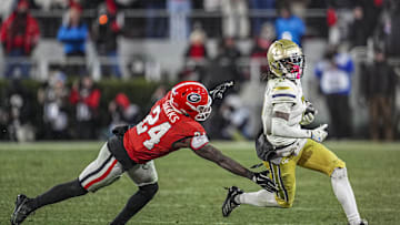 Nov 29, 2024; Athens, Georgia, USA; Georgia Tech Yellow Jackets wide receiver Eric Singleton Jr. (2) runs against Georgia Bulldogs defensive back Malaki Starks (24) during the second half at Sanford Stadium. Mandatory Credit: Dale Zanine-Imagn Images