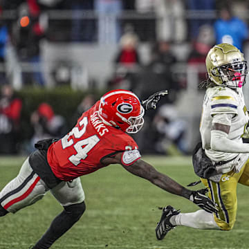 Nov 29, 2024; Athens, Georgia, USA; Georgia Tech Yellow Jackets wide receiver Eric Singleton Jr. (2) runs against Georgia Bulldogs defensive back Malaki Starks (24) during the second half at Sanford Stadium. Mandatory Credit: Dale Zanine-Imagn Images