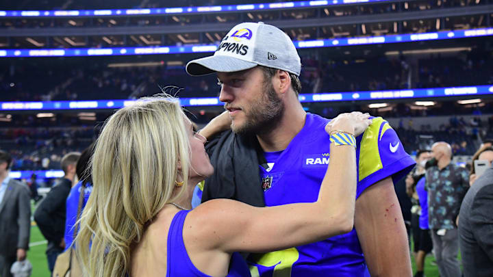 Los Angeles Rams quarterback Matthew Stafford (9) with wife Kelly Hall after defeating the San Francisco 49ers in the NFC Championship Game at SoFi Stadium. Los Angeles Rams quarterback Matthew Stafford (9) with wife Kelly Hall after defeating the San Francisco 49ers in the NFC Championship Game at SoFi Stadium.