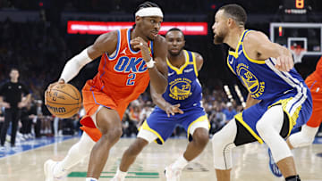 Nov 10, 2024; Oklahoma City, Oklahoma, USA; Oklahoma City Thunder guard Shai Gilgeous-Alexander (2) drives to the basket against Golden State Warriors guard Stephen Curry (30) during the second quarter at Paycom Center. Mandatory Credit: Alonzo Adams-Imagn Images