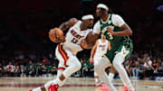 Oct 6, 2025; Miami, Florida, USA; Miami Heat center Bam Adebayo (13) drives to the basket against Milwaukee Bucks center Myles Turner (3) during the first quarter at Kaseya Center. Mandatory Credit: Sam Navarro-Imagn Images
