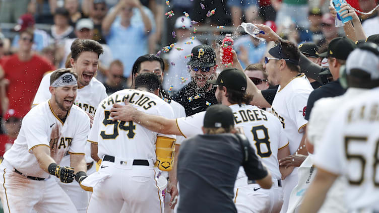 Jul 30, 2023; Pittsburgh, Pennsylvania, USA;  Pittsburgh Pirates teammates mob center fielder Josh