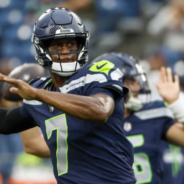 Aug 24, 2024; Seattle, Washington, USA; Seattle Seahawks quarterback Geno Smith (7) passes during pregame warmups against the Cleveland Browns at Lumen Field. Mandatory Credit: Joe Nicholson-USA TODAY Sports