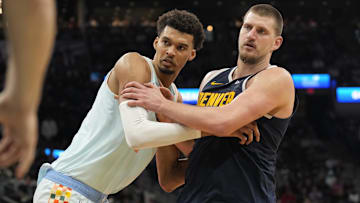 Jan 4, 2025; San Antonio, Texas, USA; San Antonio Spurs center Victor Wembanyama (1) and Denver Nuggets center Nikola Jokic (15) battle for position during an inbound pass in the second half at Frost Bank Center. Mandatory Credit: Scott Wachter-Imagn Images