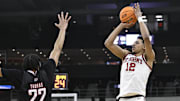 Mar 20, 2025; Providence, RI, USA;  St. John's Red Storm guard RJ Luis Jr. (12) puts up a shot against Omaha Mavericks forward Kamryn Thomas (22) during the second half at Amica Mutual Pavilion.