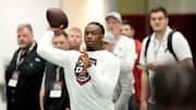 Quarterback Jalen Milroe throws for scouts at the University of Alabama Pro Day.
