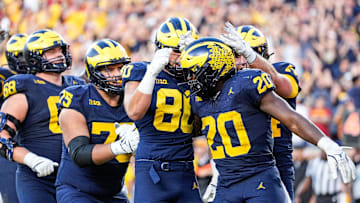 running back Kalel Mullings (20) celebrates a touchdown against USC with teammates during the second half at Michigan Stadium in Ann Arbor on Saturday, Sept. 21, 2024.