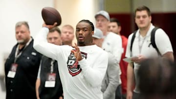 Mar 19, 2025; Tuscaloosa AL, USA; Quarterback Jalen Milroe throws for scouts at the University of Alabama Pro Day as several Crimson Tide players worked out for NFL teams in the Hank Crisp Indoor Practice Facility.