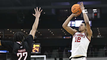 Mar 20, 2025; Providence, RI, USA;  St. John's Red Storm guard RJ Luis Jr. (12) puts up a shot against Omaha Mavericks forward Kamryn Thomas (22) during the second half at Amica Mutual Pavilion.