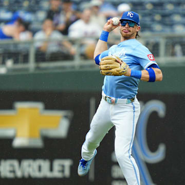 Jul 13, 2025; Kansas City, Missouri, USA; Kansas City Royals shortstop Bobby Witt Jr. (7) makes a leaping throw during the fifth inning against the New York Mets at Kauffman Stadium. Mandatory Credit: Jay Biggerstaff-Imagn Images