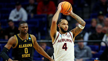Mar 20, 2025; Lexington, KY, USA;  Auburn Tigers forward Johni Broome (4) handles the ball against Alabama State Hornets forward D'Ante Bass (0) during the second half in the first round of the NCAA Tournament at Rupp Arena. Mandatory Credit: Jordan Prather-Imagn Images