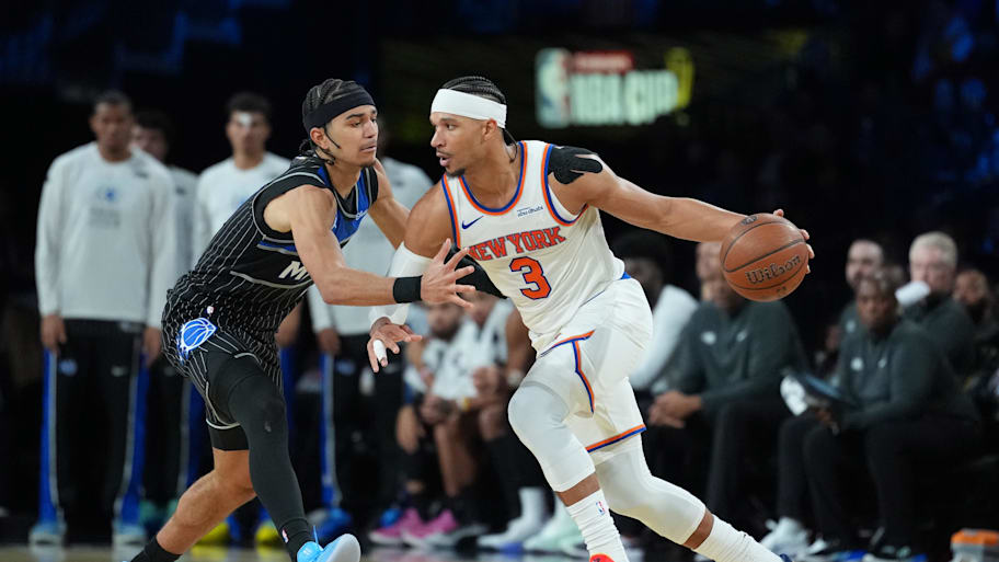 Knicks guard Josh Hart works around Magic guard Anthony Black during an NBA Cup semifinal game.