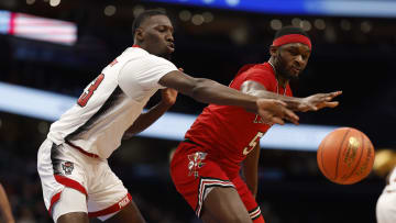 Mar 12, 2024; Washington, D.C., USA; Louisville Cardinals forward Brandon Huntley-Hatfield (5) and North Carolina State Wolfpack forward Mohamed Diarra (23) battle for the ball in the first half at Capital One Arena. Mandatory Credit: Geoff Burke-USA TODAY Sports