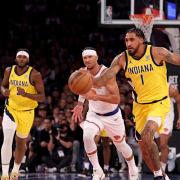 Indiana Pacers forward Obi Toppin brings the ball up court against New York Knicks guards Josh Hart and Miles McBride. Mandatory Credit: Brad Penner-Imagn Images