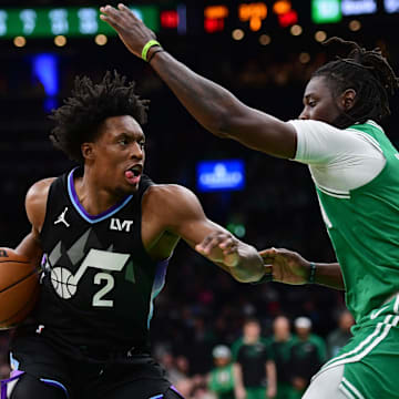 Mar 10, 2025; Boston, Massachusetts, USA; Utah Jazz guard Collin Sexton (2) controls the ball while Boston Celtics guard Jrue Holiday (4) defends during the second half at TD Garden. Mandatory Credit: Bob DeChiara-Imagn Images
