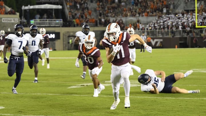 Sep 2, 2023; Blacksburg, Virginia, Virginia Tech Hokies wide receiver Tucker Holloway (11) returns an Old Dominion punt in the fourth quarter at Lane Stadium. Mandatory Credit: Lee Luther Jr.-Imagn Images.