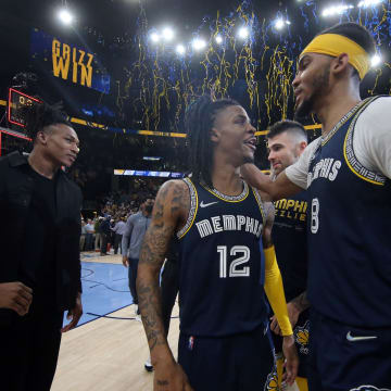 May 3, 2022; Memphis, Tennessee, USA; Memphis Grizzlies guard Ja Morant (12) reacts with forward Ziaire Williams (8) after defeating the Golden State Warriors during game two of the second round for the 2022 NBA playoffs at FedExForum. 