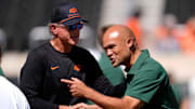 Oklahoma State Interim Head Coach/Offensive Coordinator Doug Meacham and Dave Aranda talk before the college football game between the Oklahoma State Cowboys and the Baylor Bears at Boone Pickens Stadium in Stillwater, Okla., Saturday, Sept. 27, 2025.