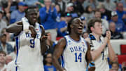 Mar 21, 2025; Raleigh, NC, USA; Duke Blue Devils center Khaman Maluach (9), guard Sion James (14) and guard Kon Knueppel (7) celebrate from the bench during the second half against the Mount St. Mary's Mountaineers in the first round of the NCAA Tournament at Lenovo Center. Mandatory Credit: Zachary Taft-Imagn Images
