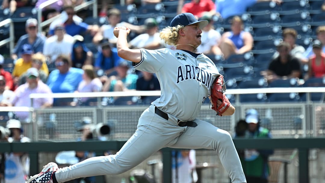 Jun 15, 2025; Omaha, Neb, USA;  Arizona Wildcats pitcher Garrett Hicks (99) throws a pitch during the eighth inning at Charles Schwab Field. Mandatory Credit: Steven Branscombe-Imagn Images