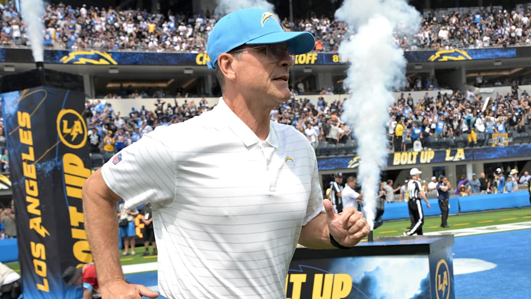 Sep 8, 2024; Inglewood, California, USA; Los Angeles Chargers head coach Jim Harbaugh runs on to the field for the game against the Las Vegas Raiders at SoFi Stadium. Mandatory Credit: Jayne Kamin-Oncea-Imagn Images