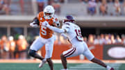Sep 28, 2024; Austin, Texas, USA;  Texas Longhorns wide receiver Ryan Wingo (5) puts a hand out toward Mississippi State Bulldogs safety Kobi Albert (15) in the second half at Darrell K Royal-Texas Memorial Stadium. Mandatory Credit: Daniel Dunn-Imagn Images