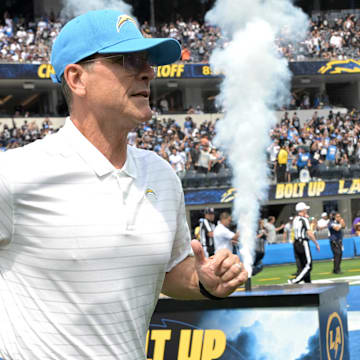 Sep 8, 2024; Inglewood, California, USA; Los Angeles Chargers head coach Jim Harbaugh runs on to the field for the game against the Las Vegas Raiders at SoFi Stadium. Mandatory Credit: Jayne Kamin-Oncea-Imagn Images