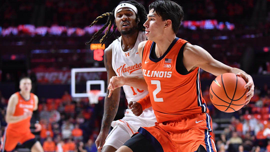 Nov 24, 2025; Champaign, Illinois, USA;  Illinois Fighting Illini guard Andrej Stojakovic (2) drives the ball as U10 defends during the first half at State Farm Center. Mandatory Credit: Ron Johnson-Imagn Images
