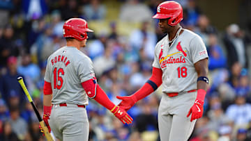 Mar 31, 2024; Los Angeles, California, USA; St. Louis Cardinals right fielder Jordan Walker (18) is greeted by second baseman Nolan Gorman (16) after scoring a run with bases loaded against the Los Angeles Dodgers during the sixth inning at Dodger Stadium. Mandatory Credit: Gary A. Vasquez-Imagn Images