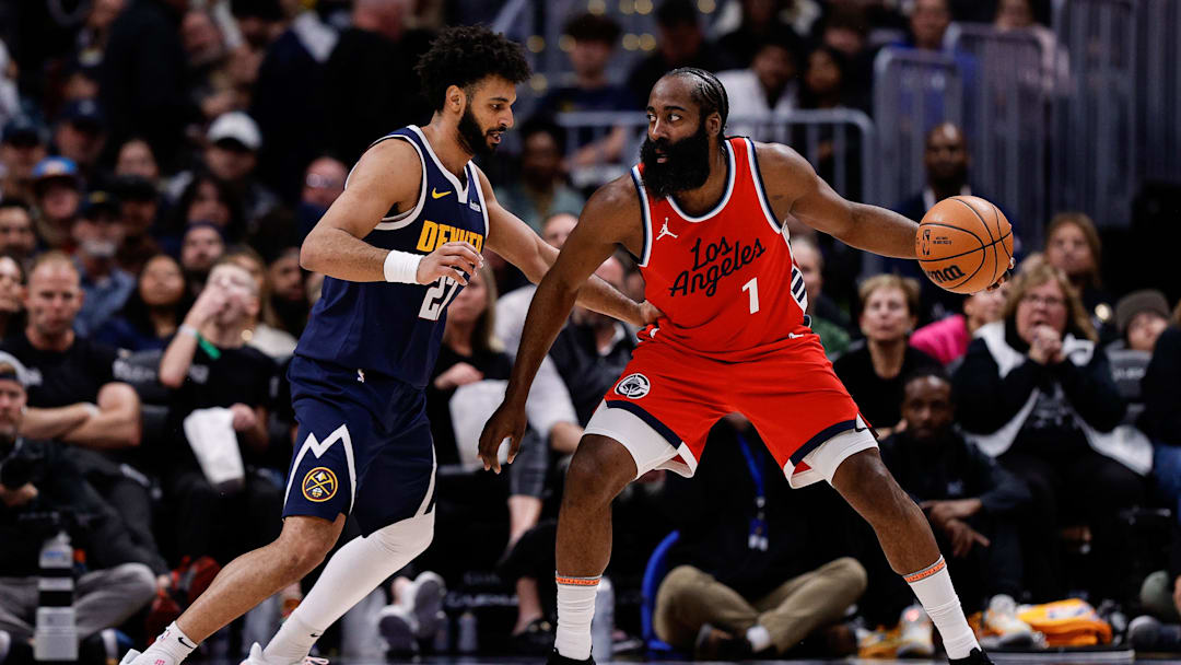 Dec 13, 2024; Denver, Colorado, USA; Los Angeles Clippers guard James Harden (1) controls the ball as Denver Nuggets guard Jamal Murray (27) guards in the third quarter at Ball Arena. Mandatory Credit: Isaiah J. Downing-Imagn Images