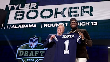 NFL Commissioner Roger Goodell poses with Dallas Cowboys first-round pick Tyler Booker at the 2025 NFL Draft