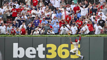 Aug 16, 2025; St. Louis, Missouri, USA;  St. Louis Cardinals center fielder Victor Scott II (11) leaps and smashes into the wall but is unable to catch a solo home run hit by New York Yankees designated hitter Aaron Judge (not pictured) during the third inning at Busch Stadium. Mandatory Credit: Jeff Curry-Imagn Images