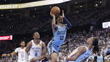 Apr 20, 2025; Oklahoma City, Oklahoma, USA; Memphis Grizzlies guard Ja Morant (12) runs into Oklahoma City Thunder forward Jaylin Williams (6) on the way to the basket during the second half at Paycom Center. Mandatory Credit: Alonzo Adams-Imagn Images