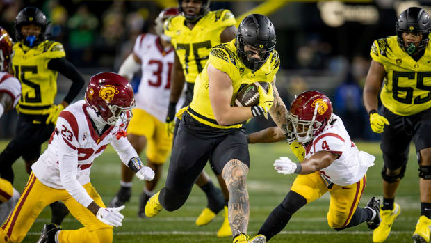 Oregon tight end Terrance Ferguson breaks through a gap in the USC defense as the No. 6 Oregon Ducks host the USC Trojans.