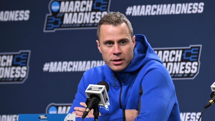 Mar 20, 2025; Raleigh, NC, USA;  Duke basketball head coach Jon Scheyer responds to a question during the NCAA pre tournament press conference at Lenovo Center.