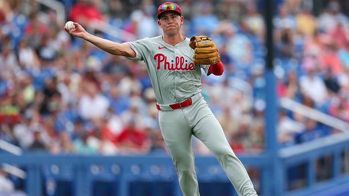 Feb 29, 2024; Dunedin, Florida, USA;  Philadelphia Phillies third baseman Scott Kingery (4) throws to first for an out against the Toronto Blue Jays in the fourth inning at TD Ballpark. Mandatory Credit: Nathan Ray Seebeck-Imagn Images
