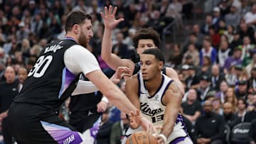Nov 28, 2025; Salt Lake City, Utah, USA; Utah Jazz center Jusuf Nurkic (30) tries to knock the ball away from Sacramento Kings forward Keegan Murray (13) during the second quarter at Delta Center. Mandatory Credit: Chris Nicoll-Imagn Images