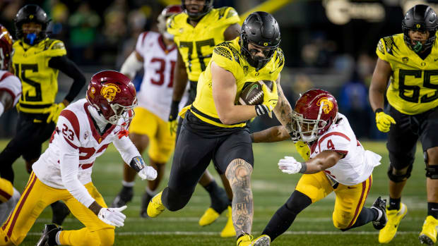 Oregon tight end Terrance Ferguson breaks through a gap in the USC defense as the No. 6 Oregon Ducks host the USC Trojans.