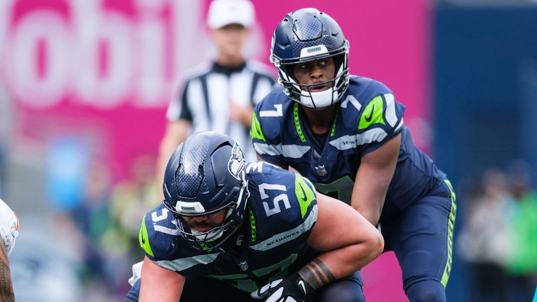 Sep 22, 2024; Seattle, Washington, USA; Seattle Seahawks center Connor Williams (57) prepares to snap the ball during the fourth quarter against the Miami Dolphins at Lumen Field. Mandatory Credit: Kevin Ng-Imagn Images